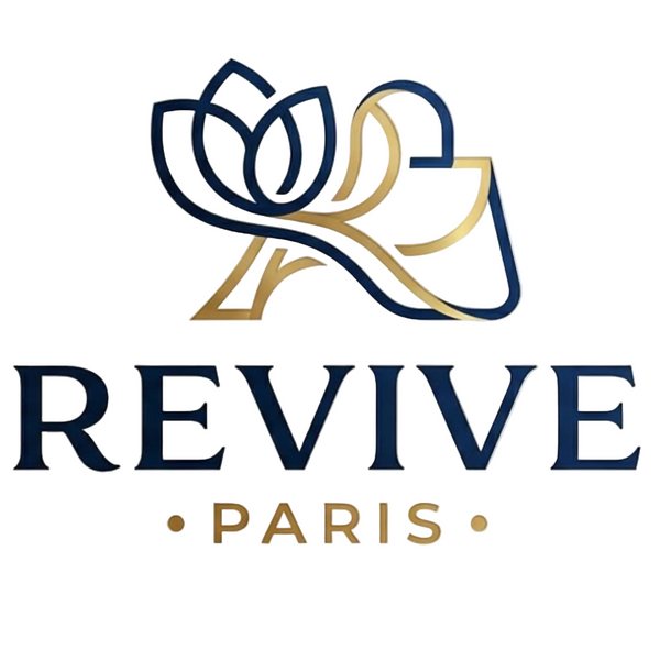 A logo-style graphic on a light warm beige background featuring a stylized flower and hand outline in navy blue and gold, with the text 'REVIVE PARIS' below in matching navy and gold.